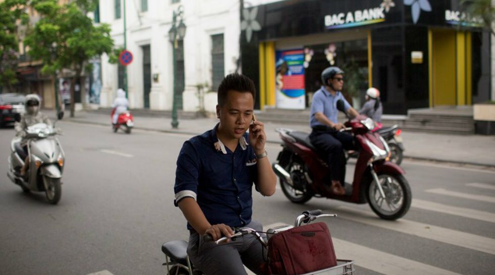 Uber loan program helps Vietnamese swap scooters for new Hondas