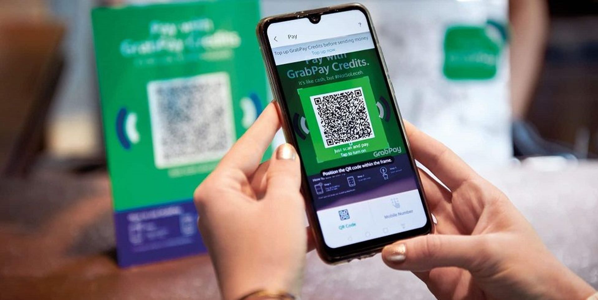 Strong demand, cost-cutting measures put Grab on path to faster breakeven