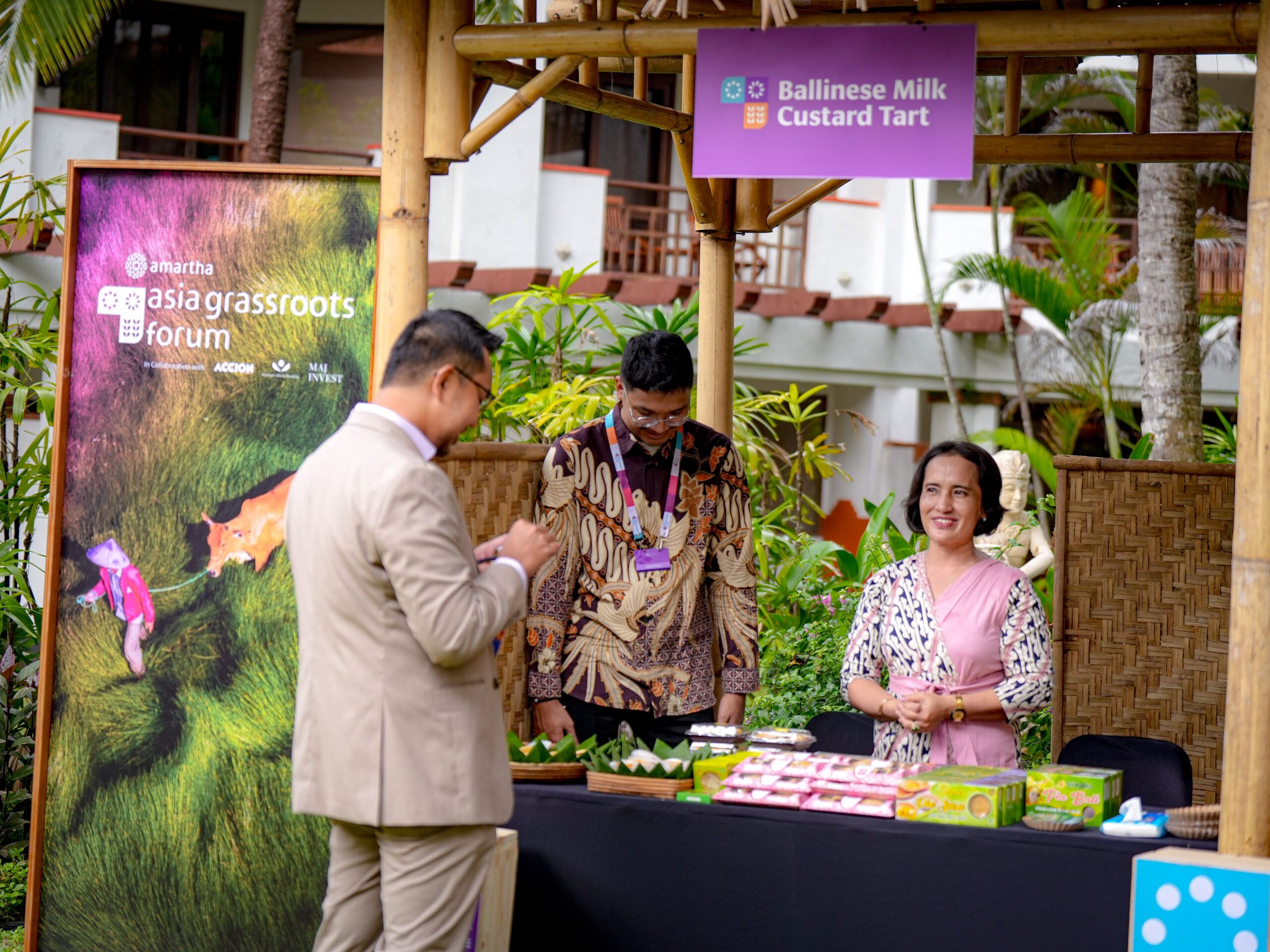 Eka Sri, Balinese milk custard tart seller serving customers at The 2025 Asia Grassroots Forum event, Bali (22/5). This forum brought the women-led micro enterprises as the testament of the grassroots economy that holds immense untapped possibilities