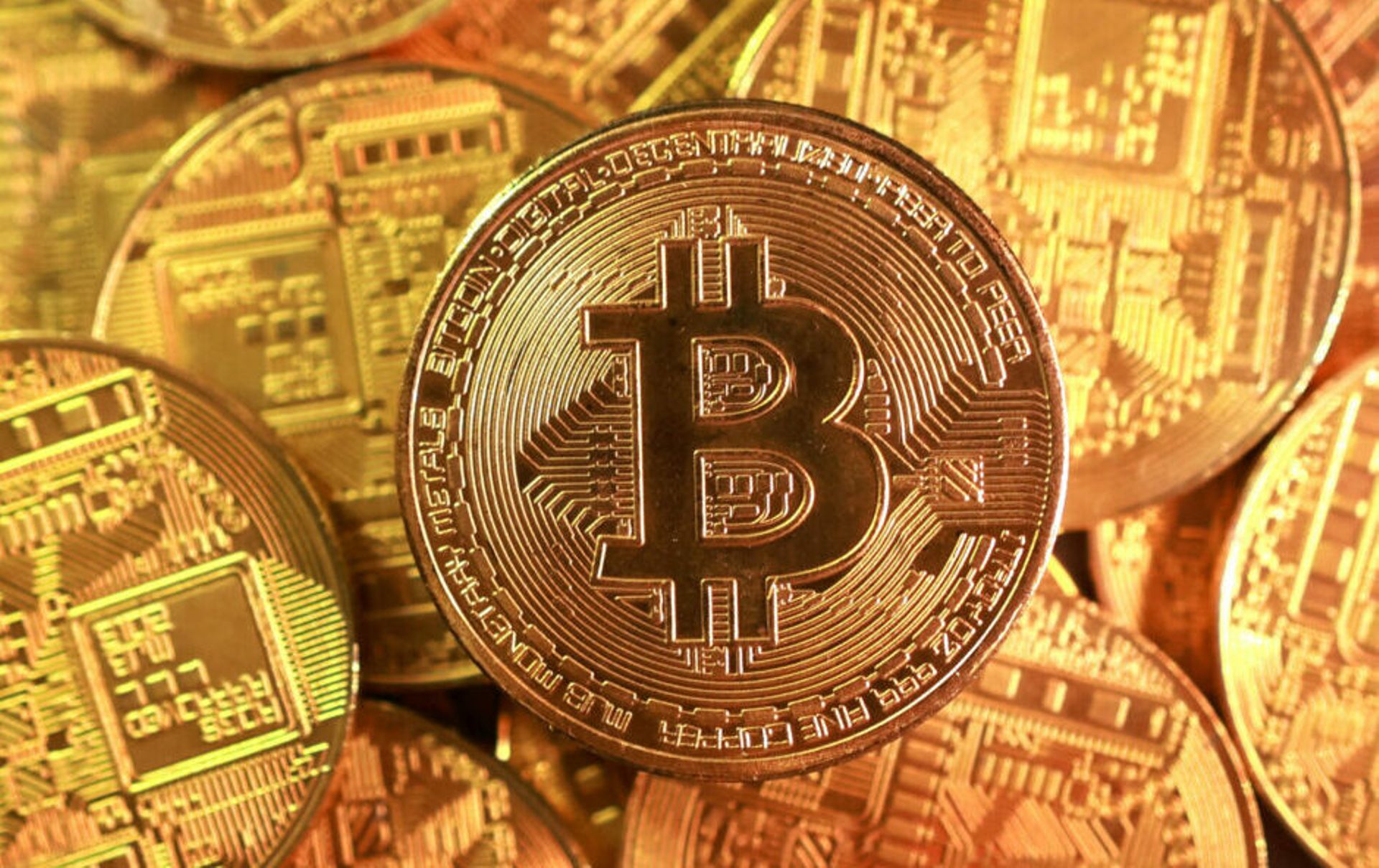 Bitcoin, ether tumble to multi-month lows amid broad flight from risk assets
