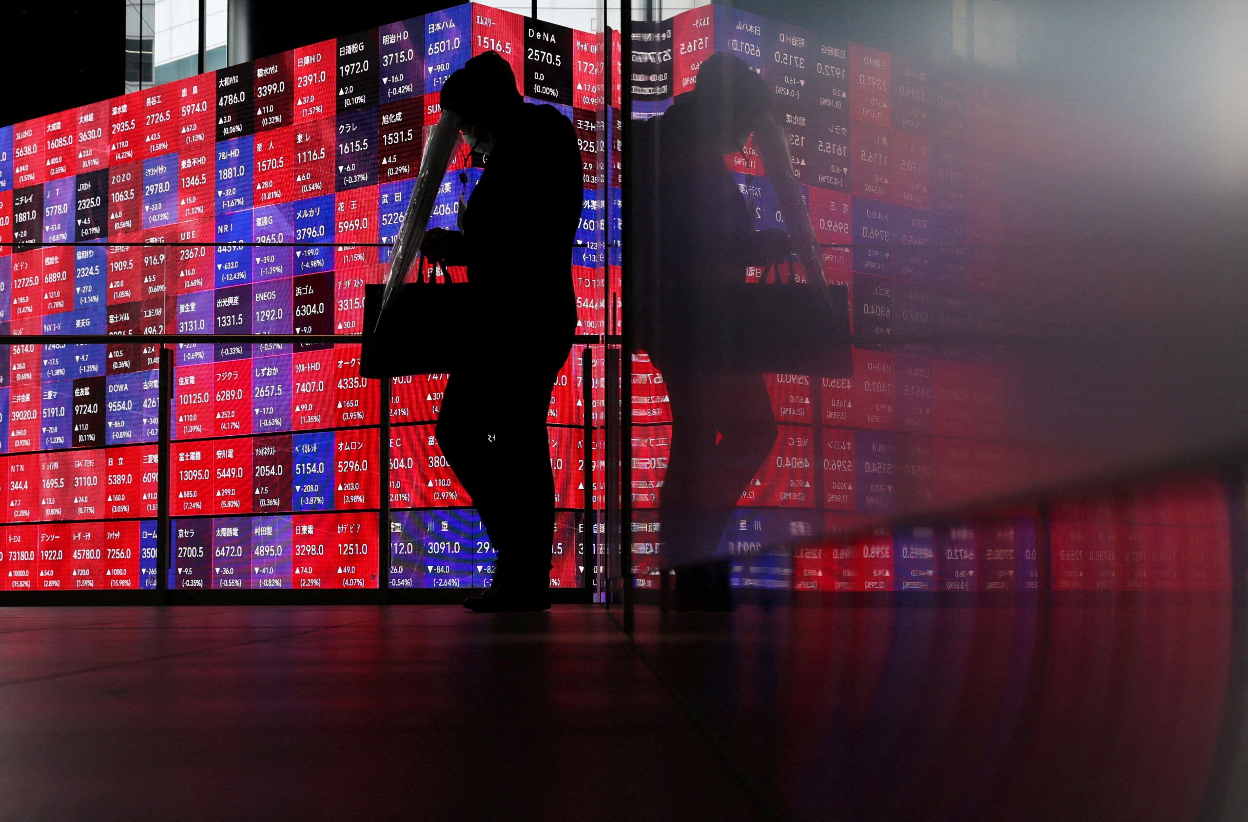 A Nikkei stock price quotation board in a Tokyo conference hall